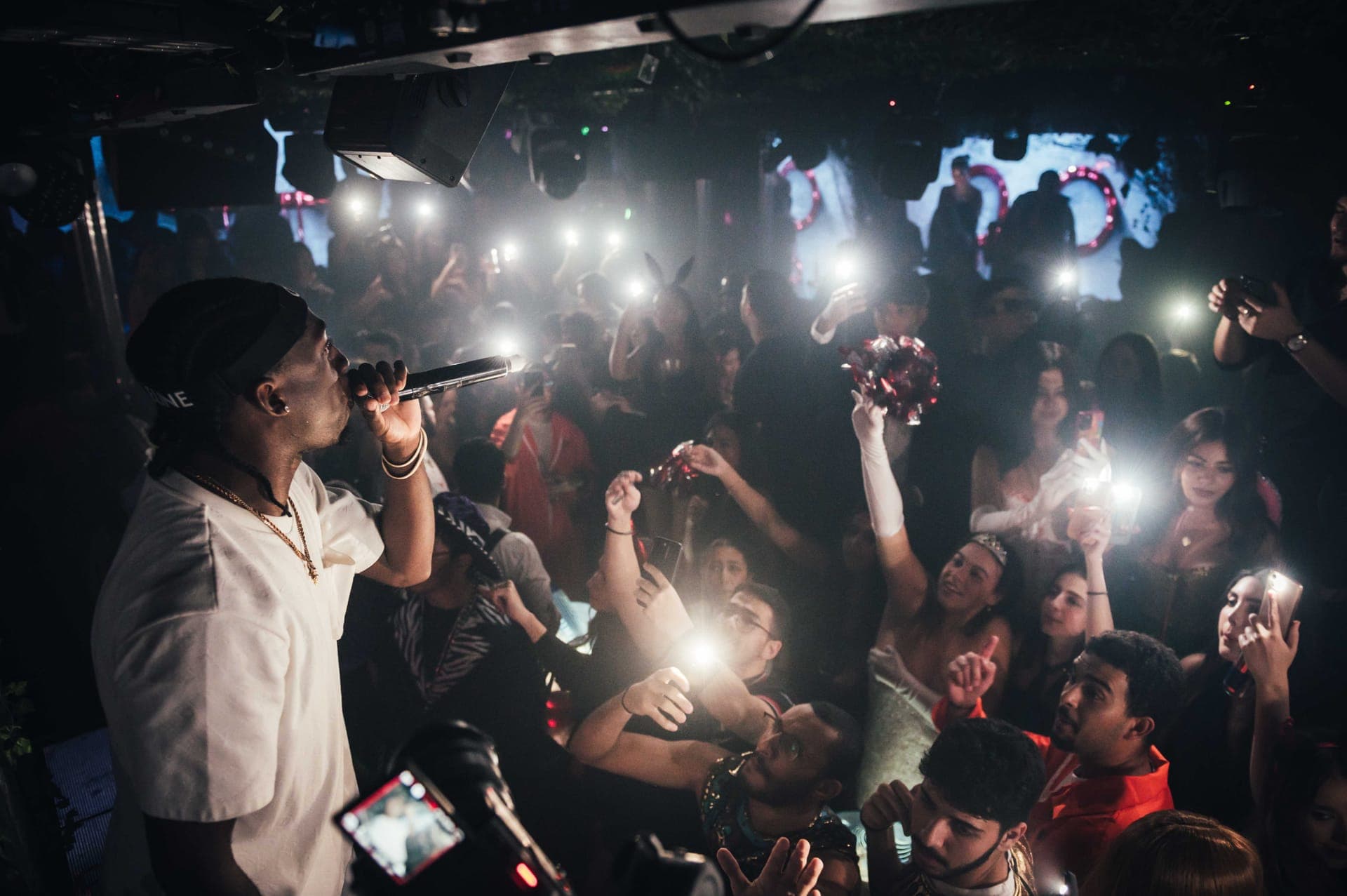 Guests arriving at a busy London nightclub entrance in Mayfair