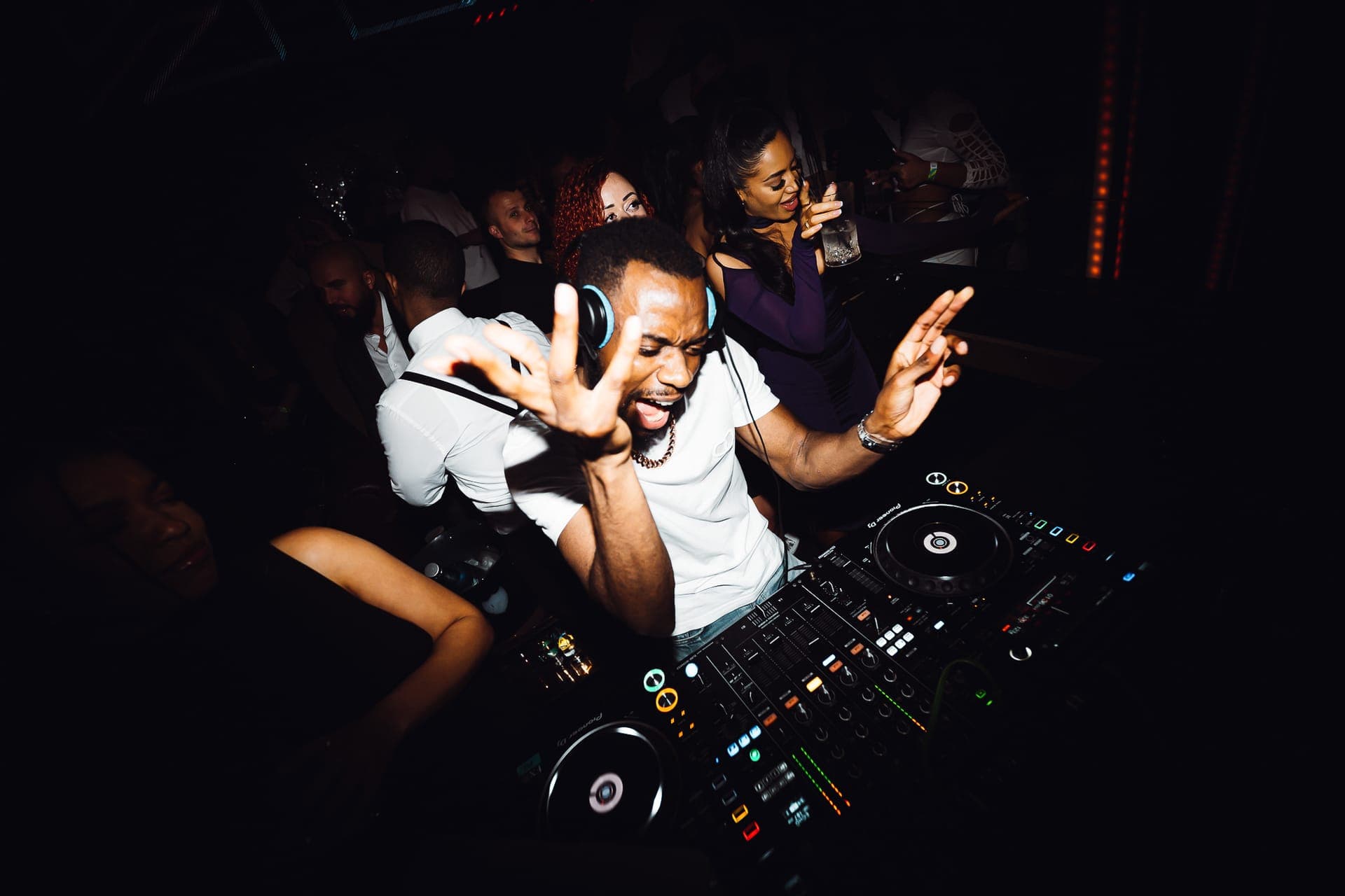 A DJ playing to a crowd at a London club night