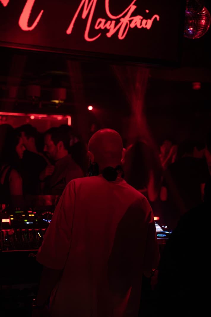 Seating and booths inside a dimly lit London nightclub lounge
