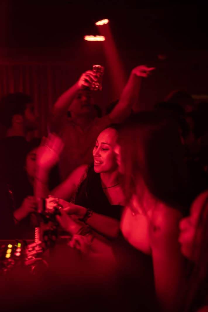 London nightclub interior with premium VIP seating and atmospheric lighting