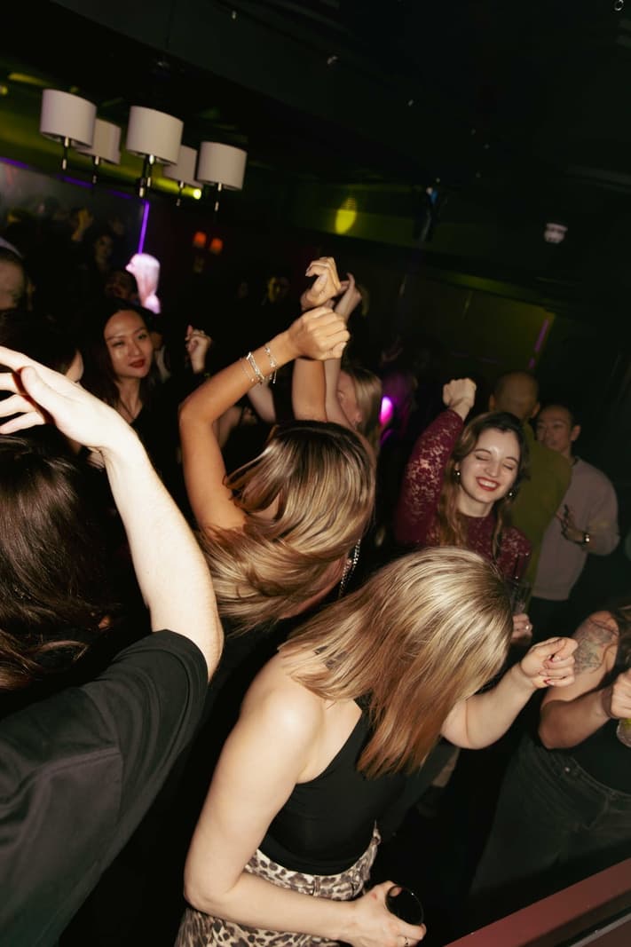 Intimate Mayfair nightclub interior with low lighting and booth seating