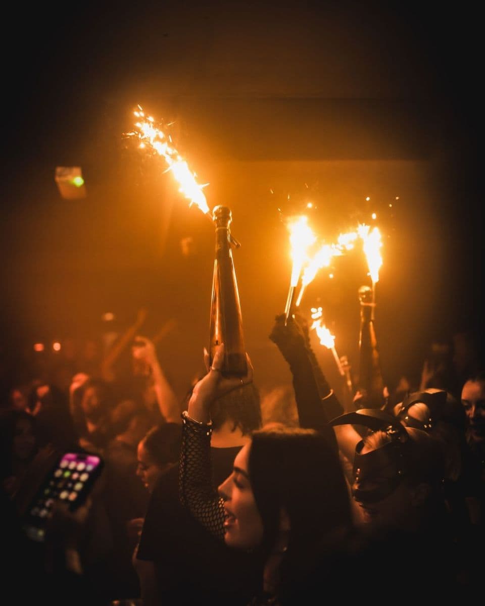 21st birthday celebration at a London VIP nightclub with champagne and sparklers