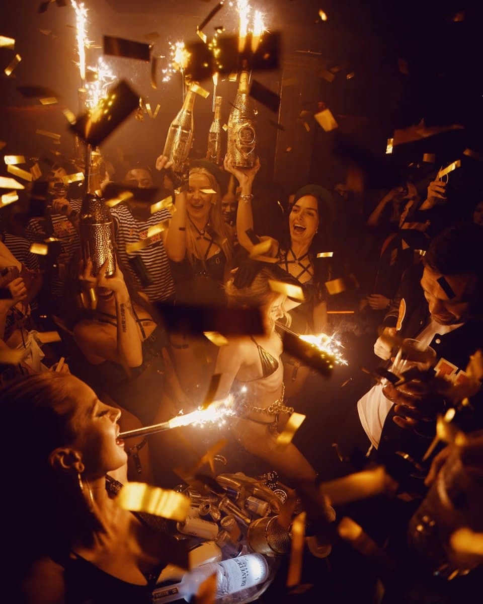 Cirque Le Soir VIP table setup with bottle service and theatrical entertainment