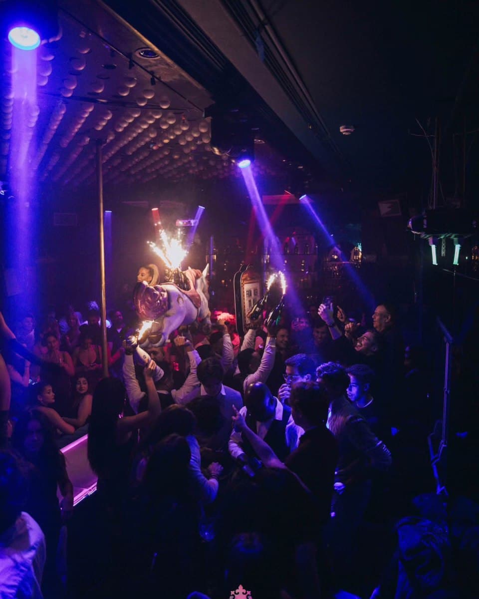 Crowd under blue and purple lights when the venue traded as the Cuckoo Club