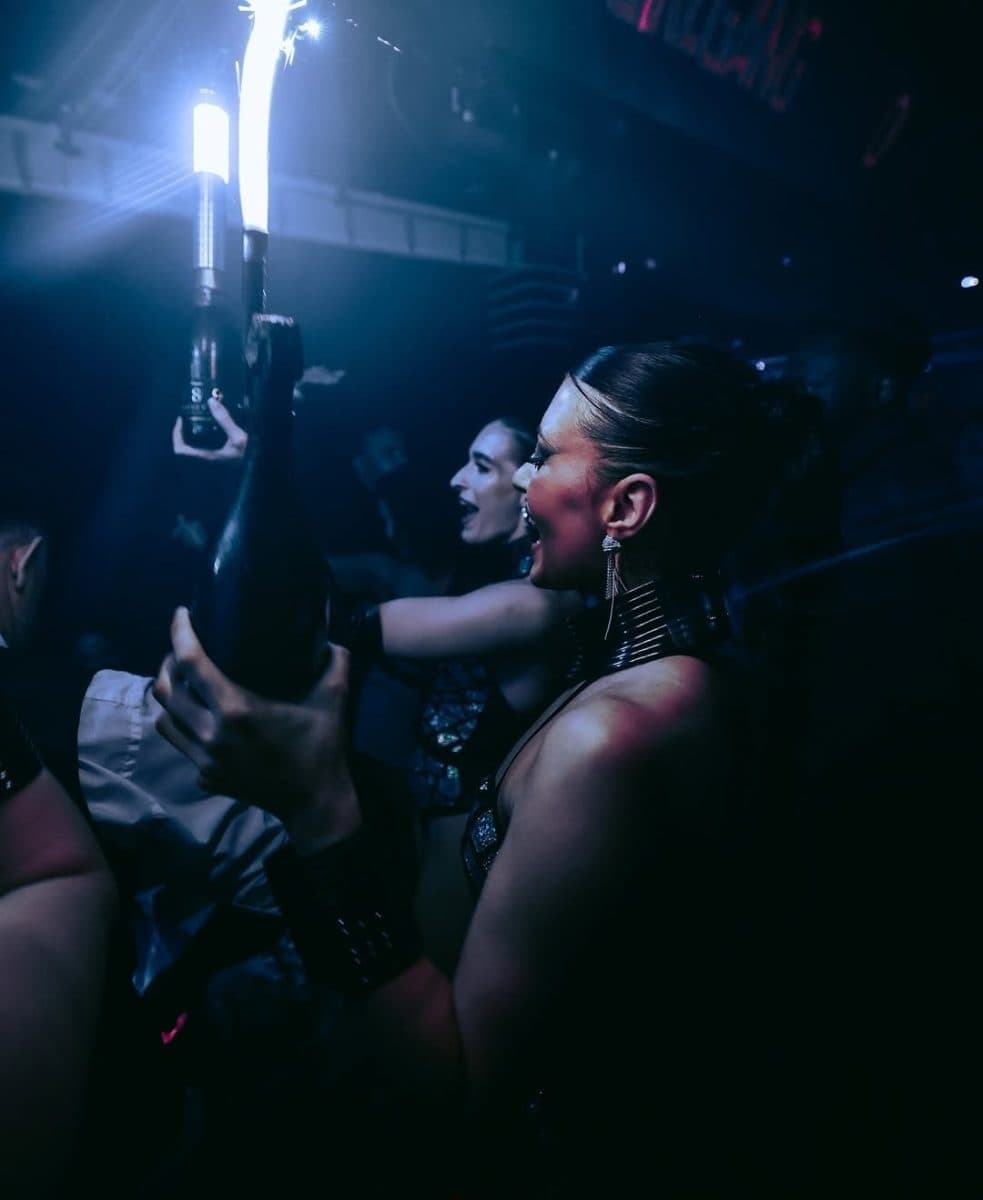 Bottle presenter holding a sparkler bottle at Funky Buddha, before the club closed