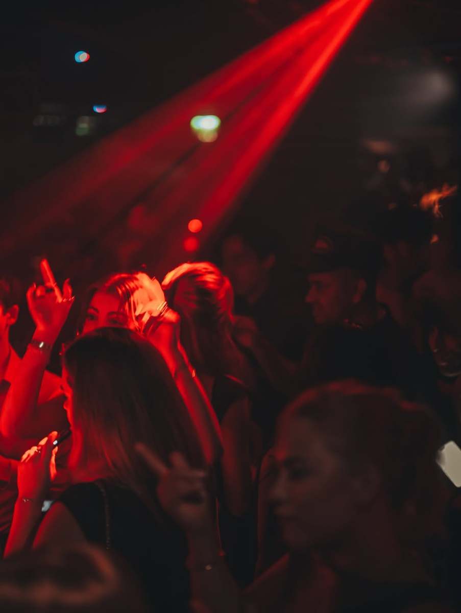 Crowd under red lights at Funky Buddha, before the club closed