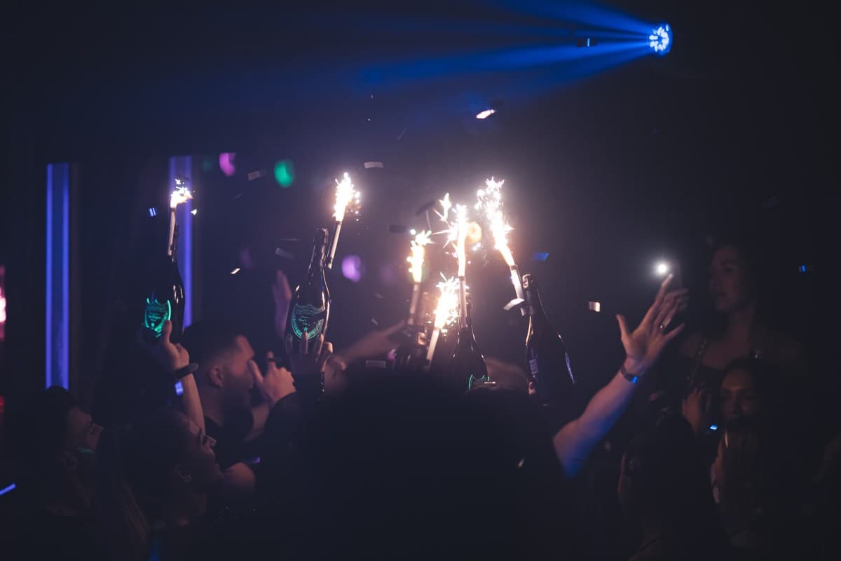 Champagne and premium bottles on a VIP table in a Mayfair nightclub