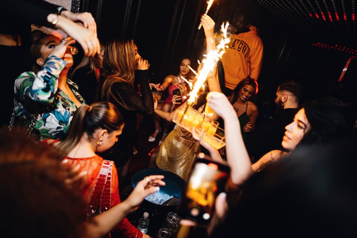 Bouncer checking ID at the entrance of a London nightclub