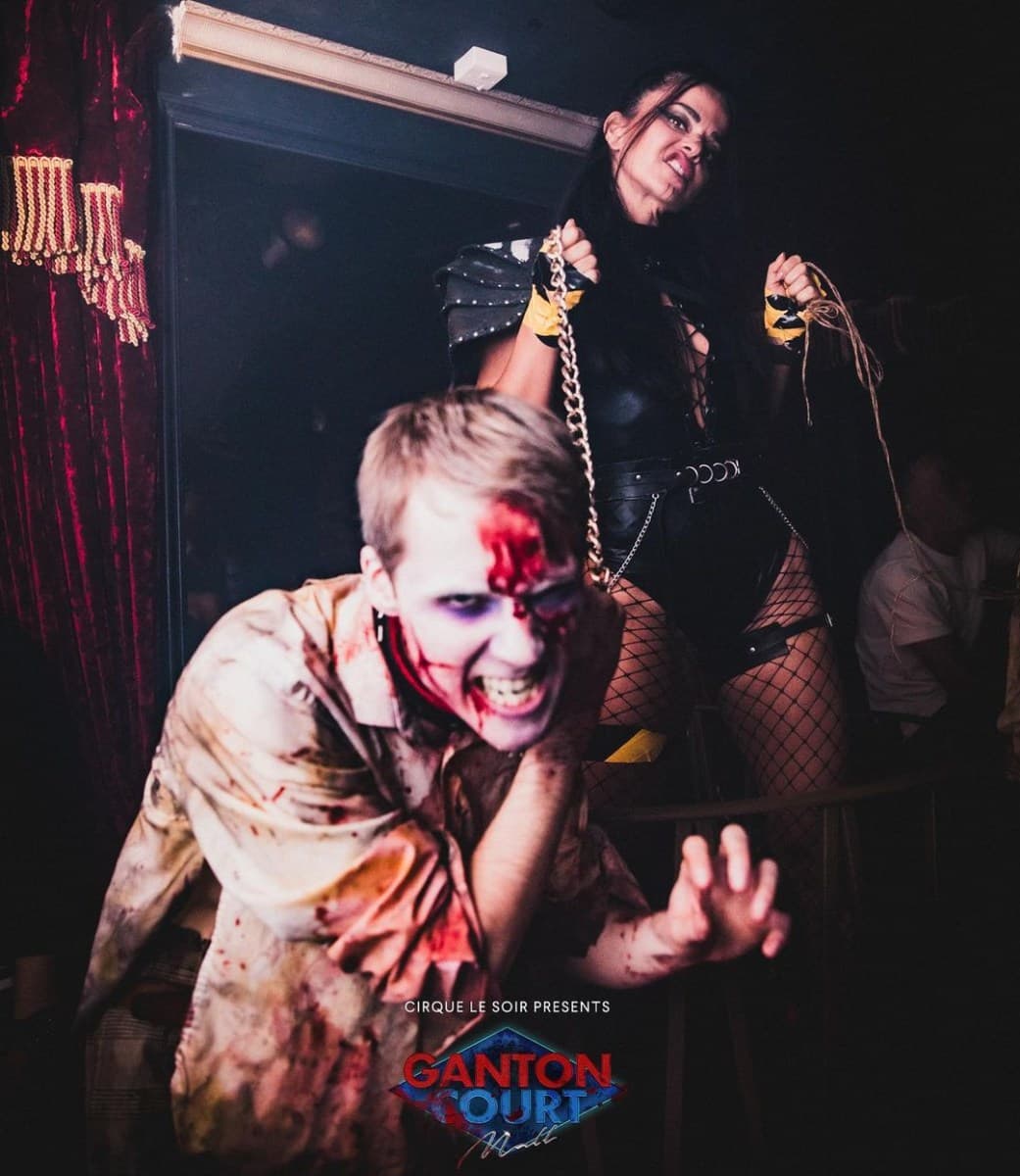 Cirque Le Soir Halloween event with costumed performers and spooky decorations
