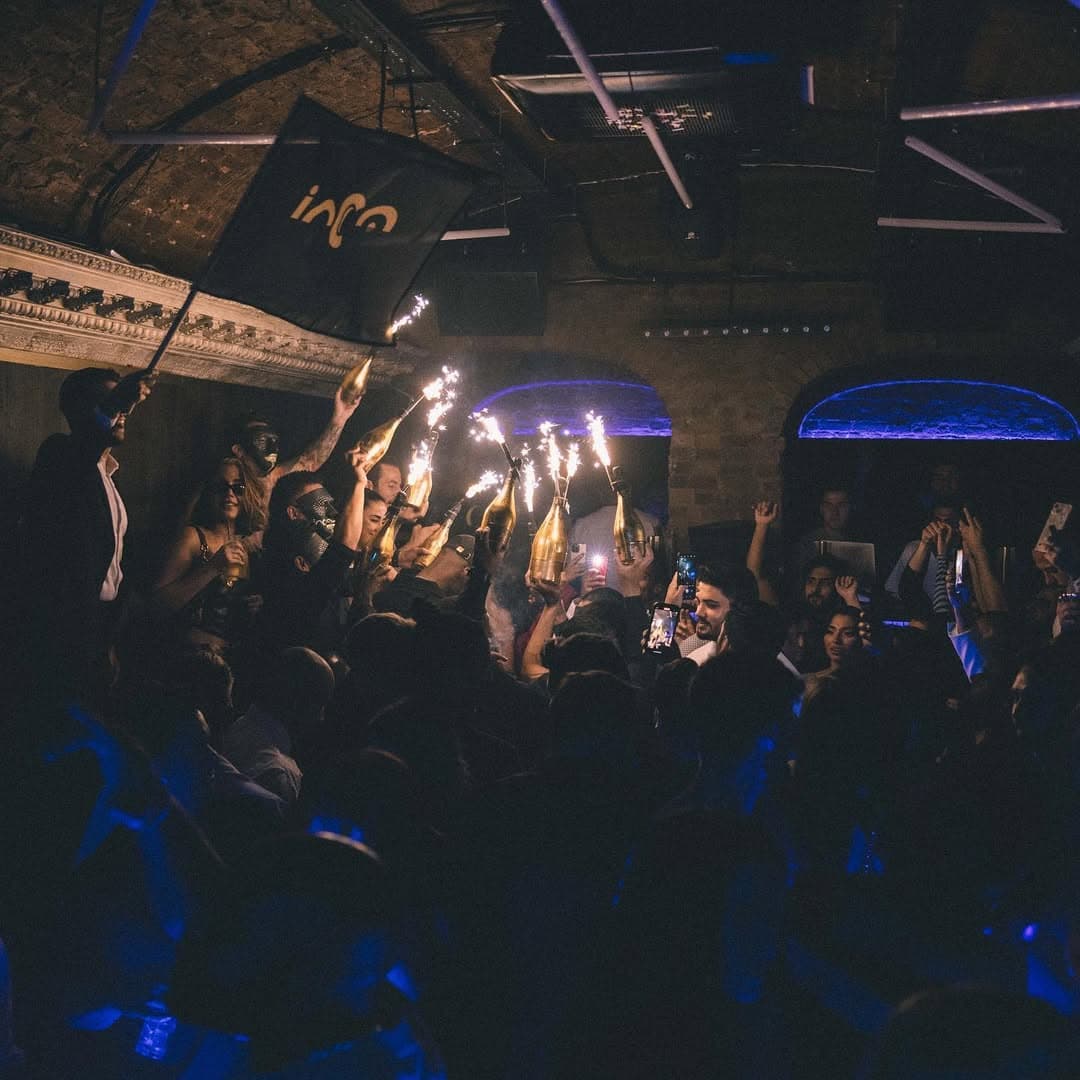 Luna London nightclub interior with atmospheric lighting and VIP table areas