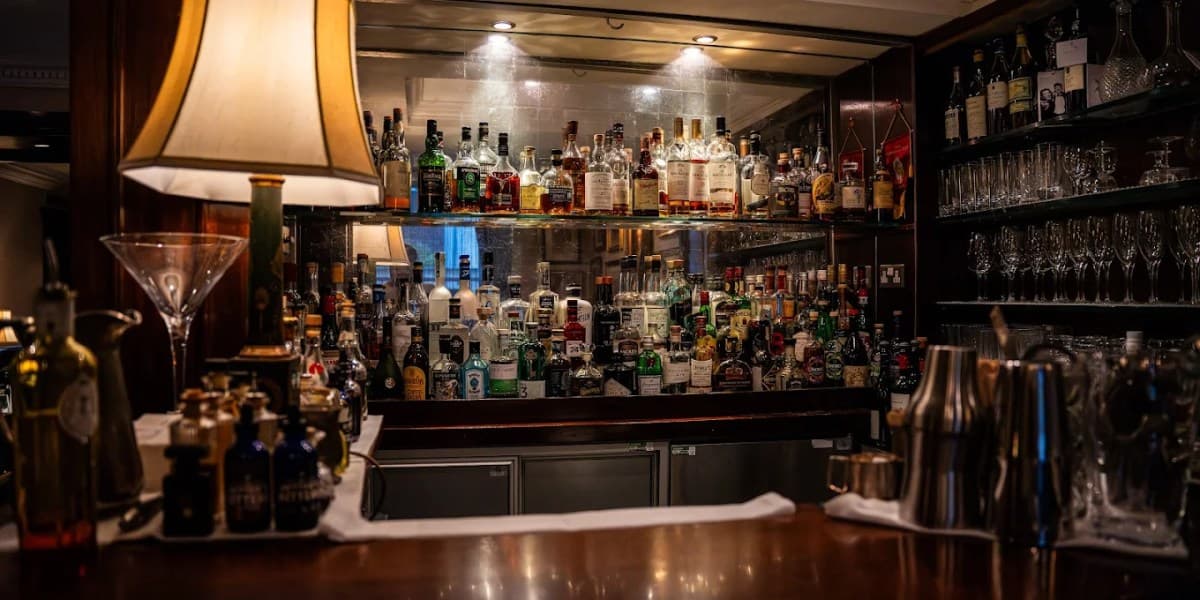 Elegant hotel bar interior in Mayfair with plush seating and a sophisticated cocktail menu