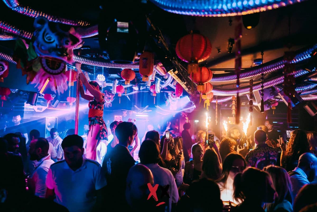 Performers and sparklers above the crowd at Luxx on Berkeley Street, before the club closed
