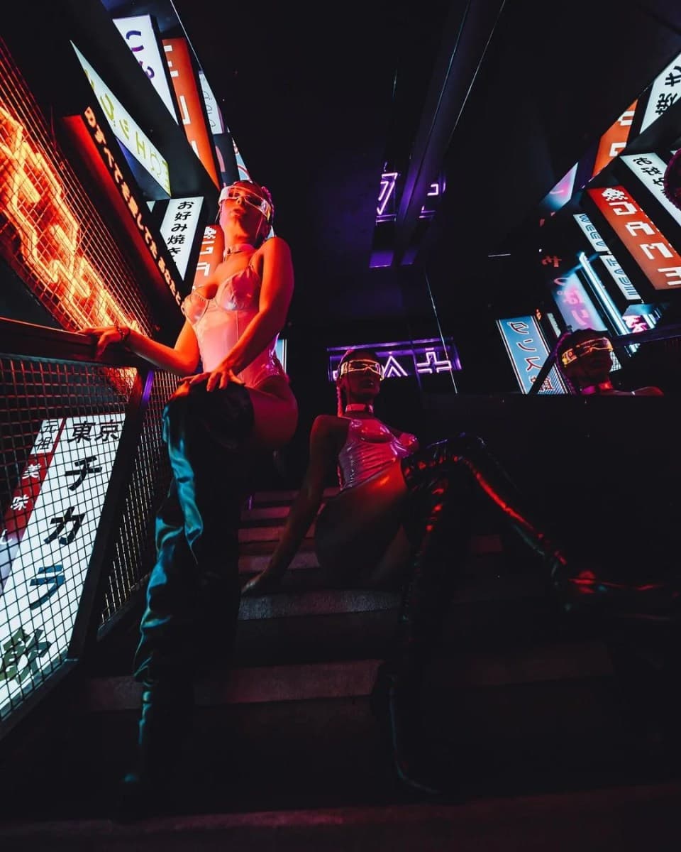 Performer on the neon-lit staircase when the venue traded as Tabu London