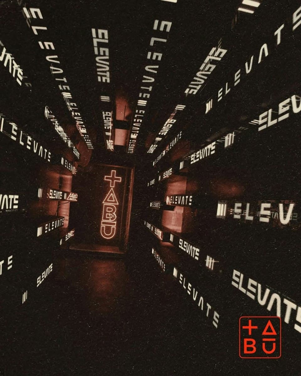 Mirrored corridor lined with Elevate signs when the venue traded as Tabu London