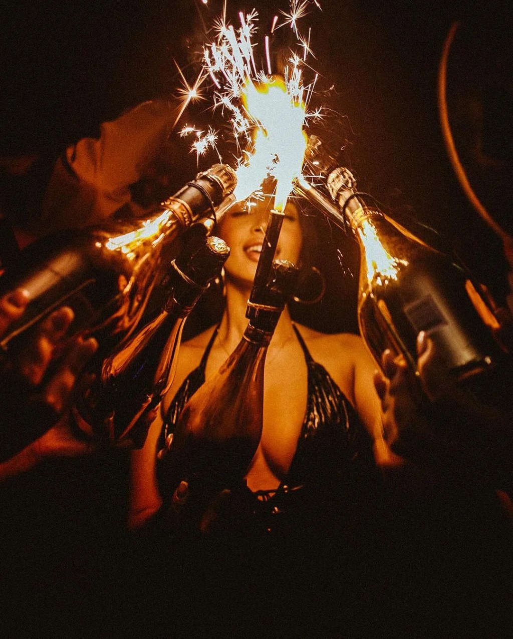 Libertine London bottle girl holding a champagne bottle for a champagne show.