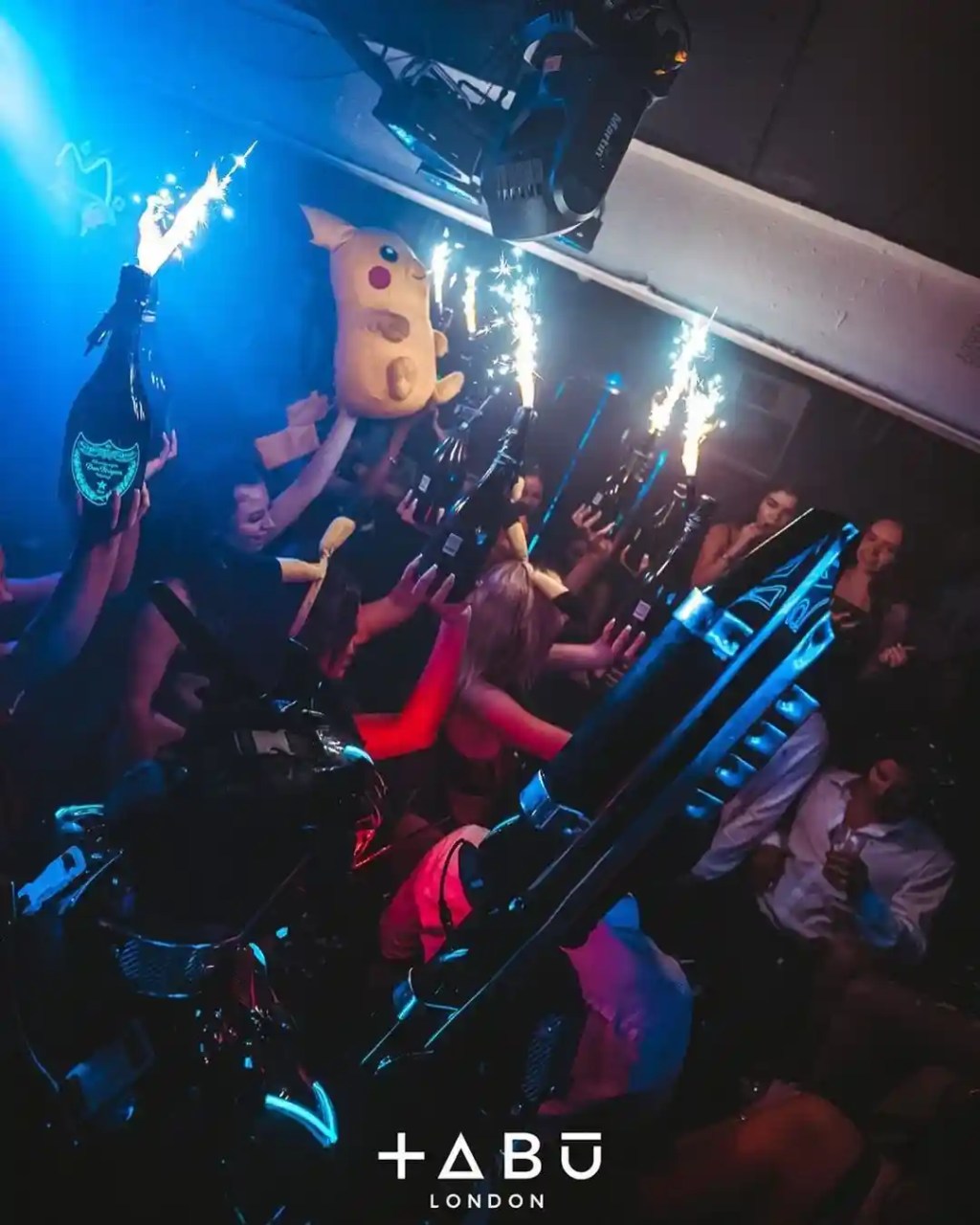 Tabu Nightclub London champagne show with a giant Pikachu in the background.