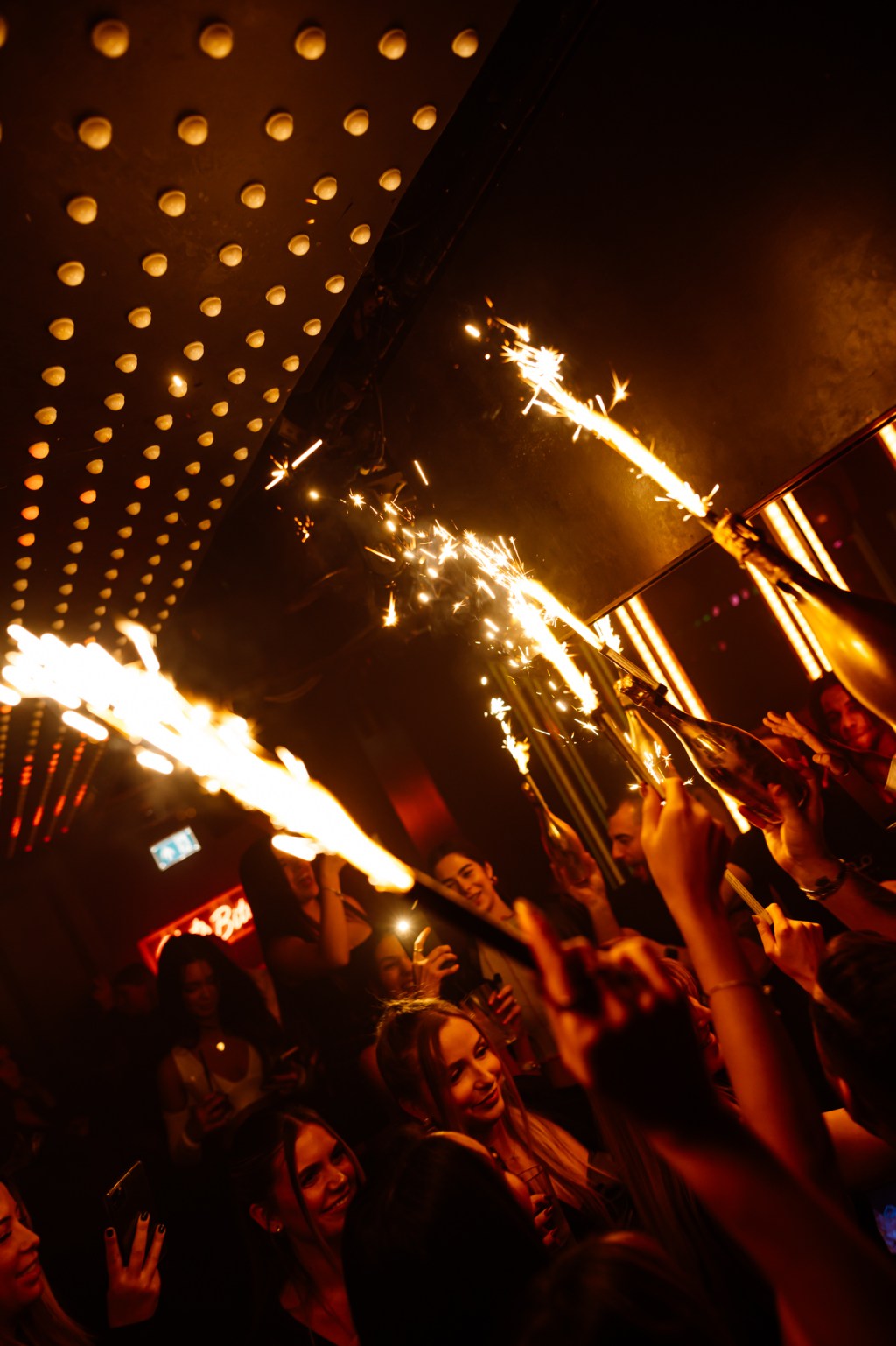 Tape London guestlist clients enjoying a champagne show.