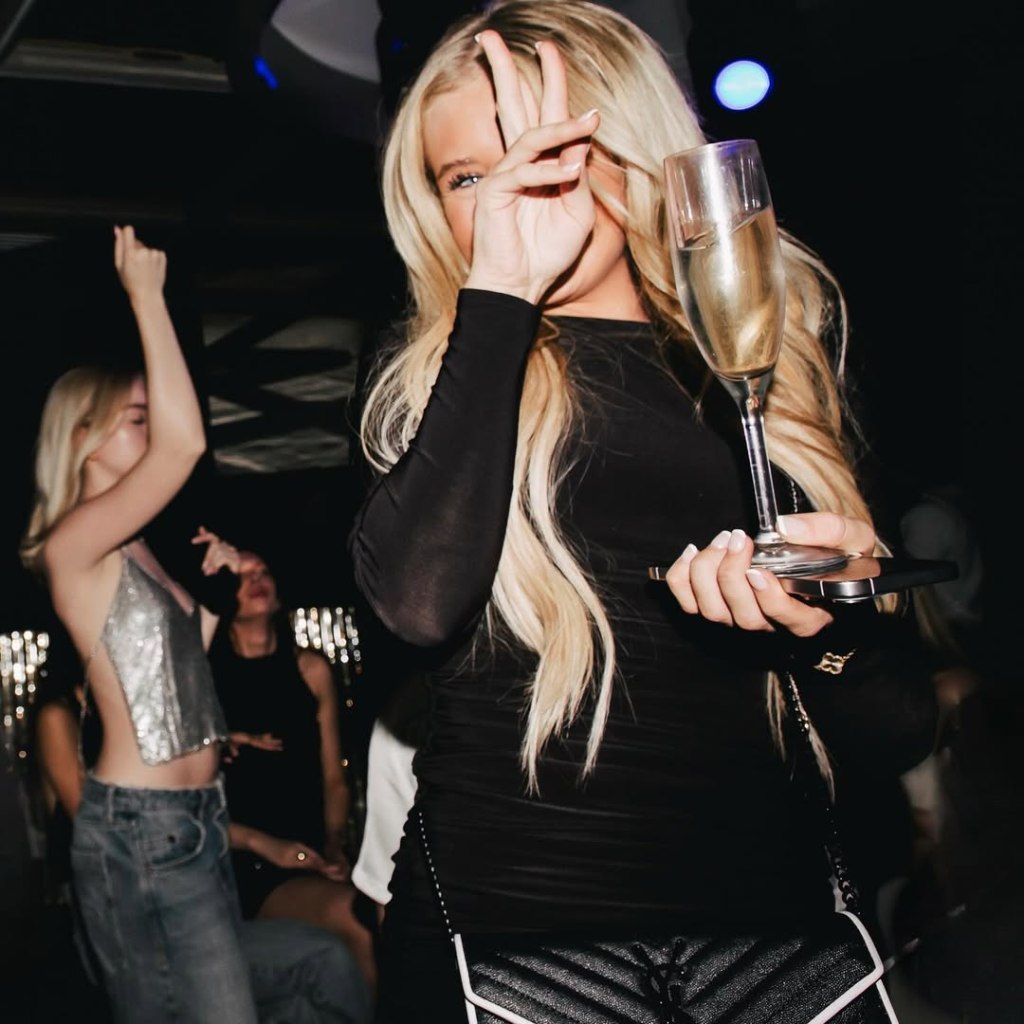 Maddox nightclub table client posing for a photo.