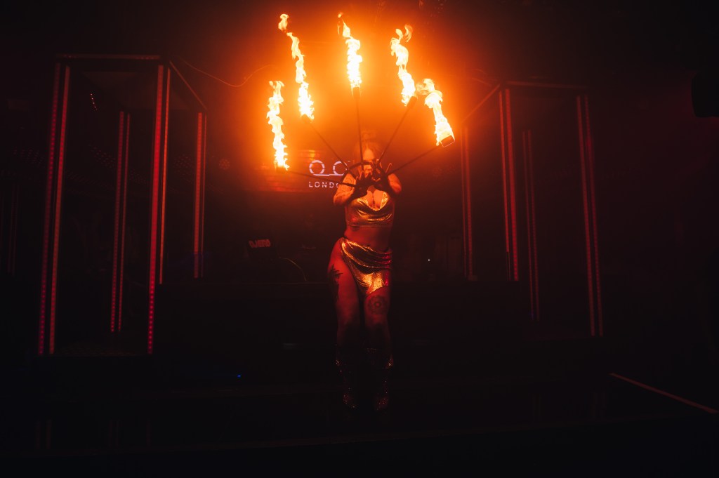 Fire performer doing a show at a London club where shisha is offered.