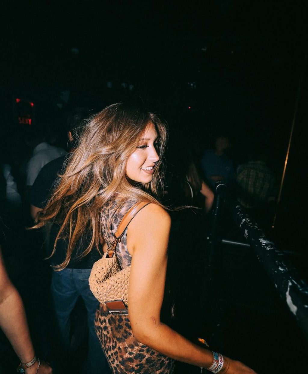 A girl on the Funky Buddha Club guestlist dancing during a party.